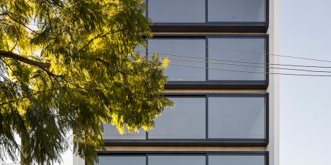 Brazilian apartment block by Arquitetura Nacional features a wall of sliding windows