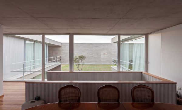 Moarqs and Ottolenghi Architects wrap Lamas House with concrete screen