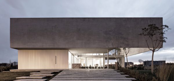 Moarqs and Ottolenghi Architects wrap Lamas House with concrete screen