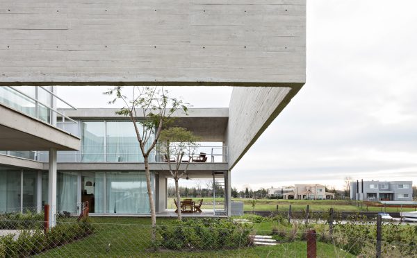 Moarqs and Ottolenghi Architects wrap Lamas House with concrete screen
