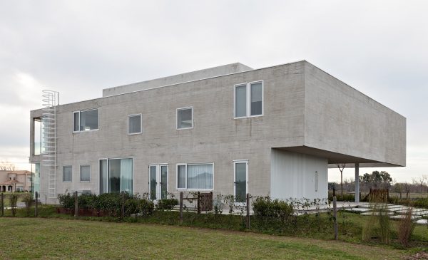 Moarqs and Ottolenghi Architects wrap Lamas House with concrete screen