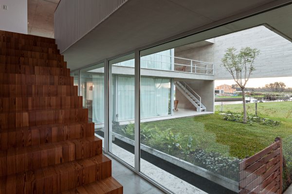 Moarqs and Ottolenghi Architects wrap Lamas House with concrete screen
