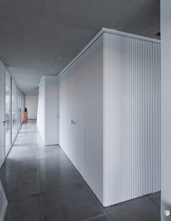 Moarqs and Ottolenghi Architects wrap Lamas House with concrete screen