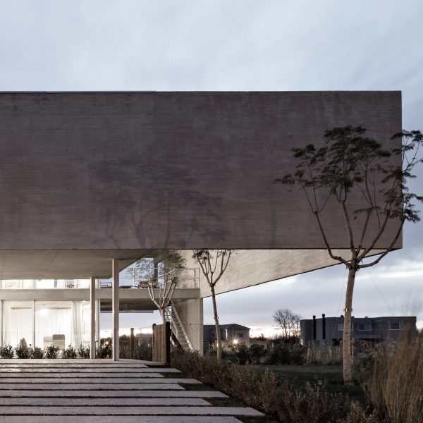 Moarqs and Ottolenghi Architects wrap Lamas House with concrete screen