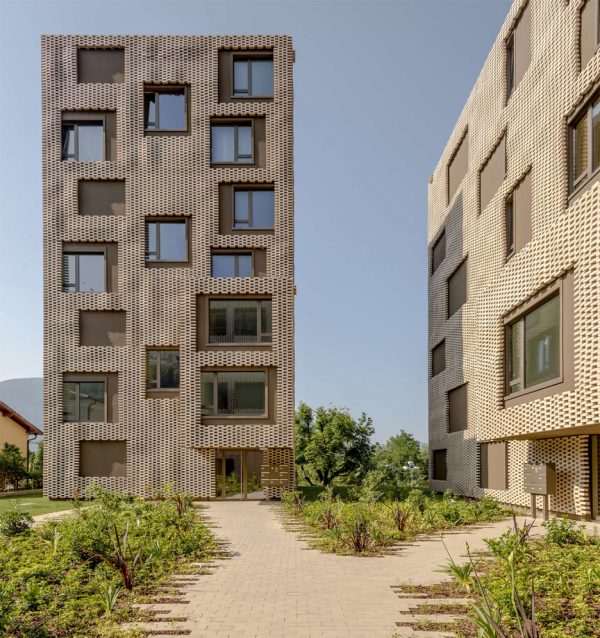 Brick "pixel patchwork" envelops Residenza Le Stelle housing by Buzzi Studio Di Architettura