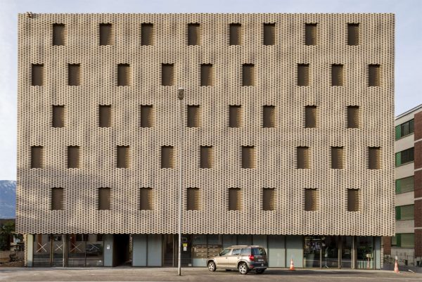 Brick "pixel patchwork" envelops Residenza Le Stelle housing by Buzzi Studio Di Architettura