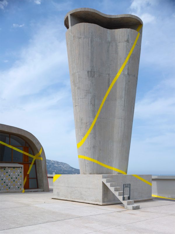 Felice Varini transforms rooftop of Le Corbusier's MAMO into optical illusion
