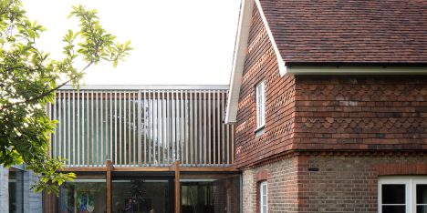 McGarry-Moon Architects adds concrete, timber and glass extension to a traditional gatehouse