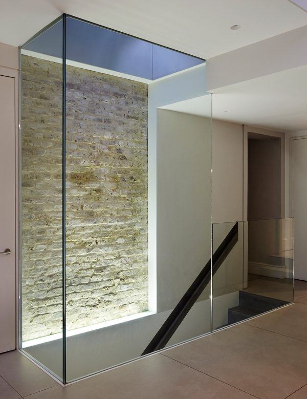 Studio Octopi adds glass-fronted extension to White Lodge house in London