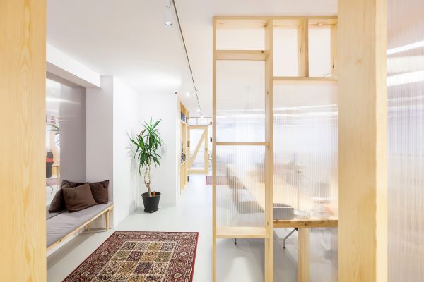 Economical workspace renovation in Warsaw by MFRMGR features semi-transparent walls