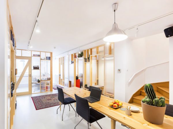 Economical workspace renovation in Warsaw by MFRMGR features semi-transparent walls