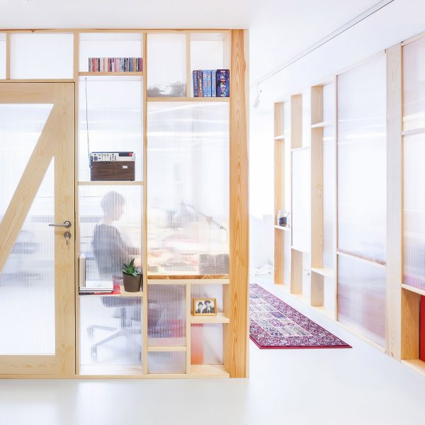 MFRMGR creates semi-transparent cubicles for sound production office in Warsaw