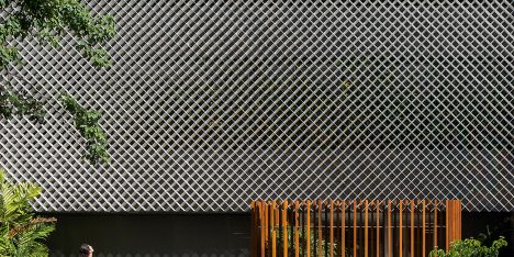 Bernardes Arquitetura completes Rio office block fronted by perforated metal and plants