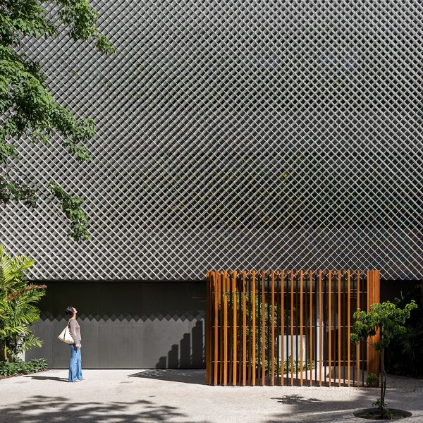 Bernardes Arquitetura completes Rio office block fronted by perforated metal and plants