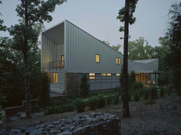 Bowtie House by deMx Architecture has an angular metal roof