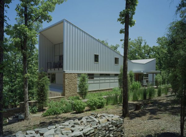 Bowtie House by deMx Architecture has an angular metal roof
