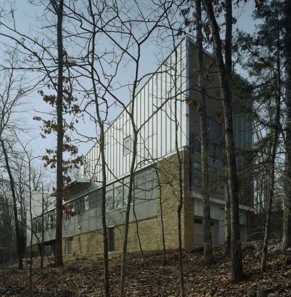 Bowtie House by deMx Architecture has an angular metal roof