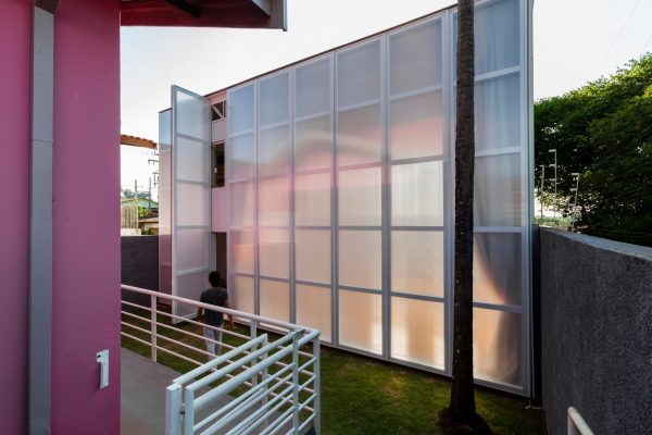Alan Chu incorporates stage with giant doors into a home for a Brazilian actor
