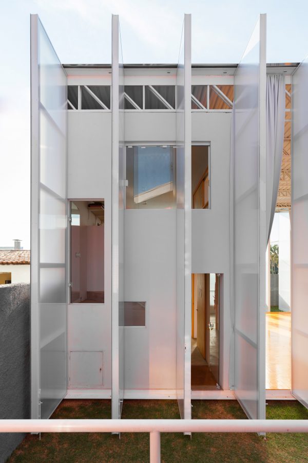Alan Chu incorporates stage with giant doors into a home for a Brazilian actor