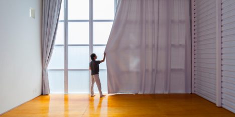 Alan Chu incorporates stage with giant doors into a home for a Brazilian actor