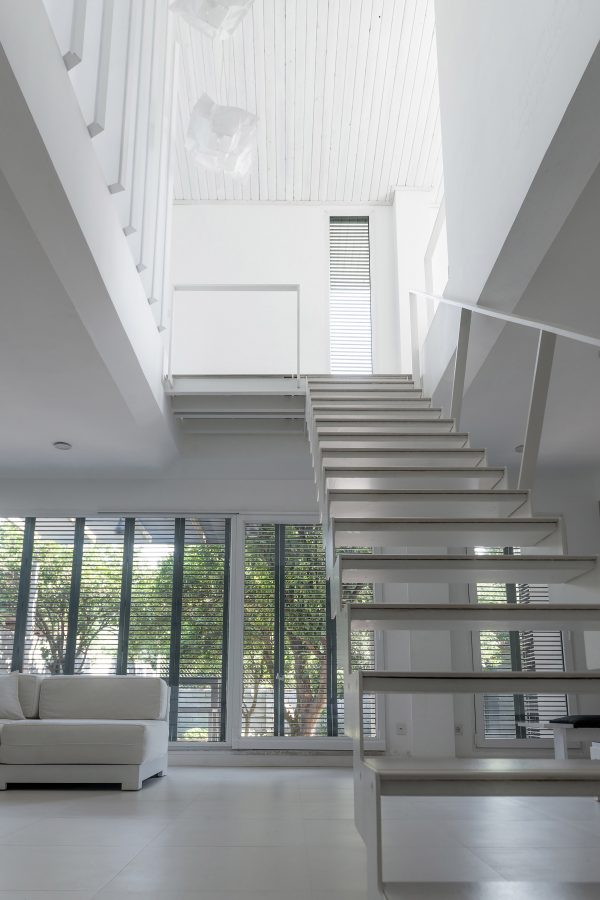 Iranian holiday home by RooyDaad Architects is black on the outside and white on the inside