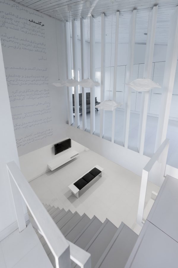 Iranian holiday home by RooyDaad Architects is black on the outside and white on the inside