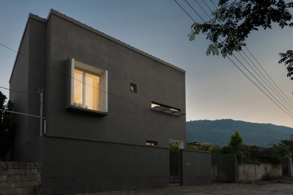 Iranian holiday home by RooyDaad Architects is black on the outside and white on the inside
