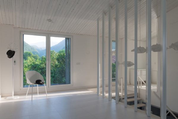 Iranian holiday home by RooyDaad Architects is black on the outside and white on the inside