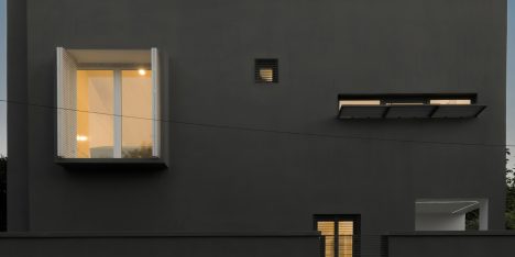 Iranian holiday home by RooyDaad Architects is black on the outside and white on the inside