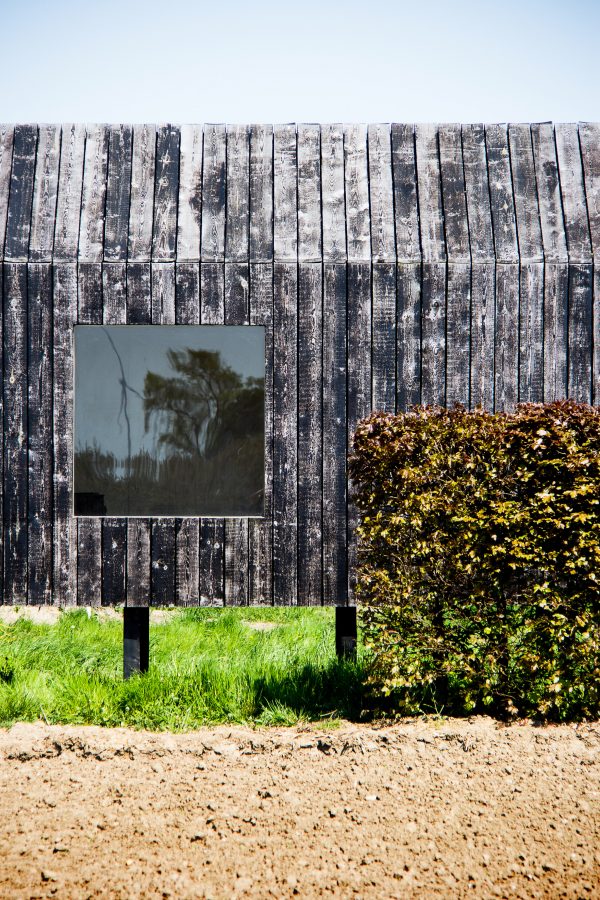 Moving walls open Stal Collectief's charred timber workshop to the elements