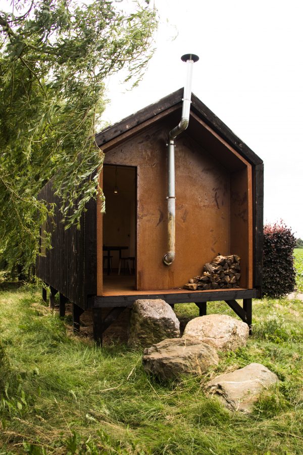 Moving walls open Stal Collectief's charred timber workshop to the elements