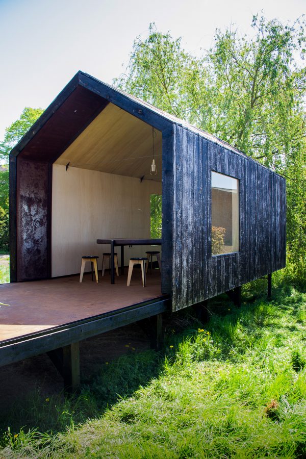 Moving walls open Stal Collectief's charred timber workshop to the elements
