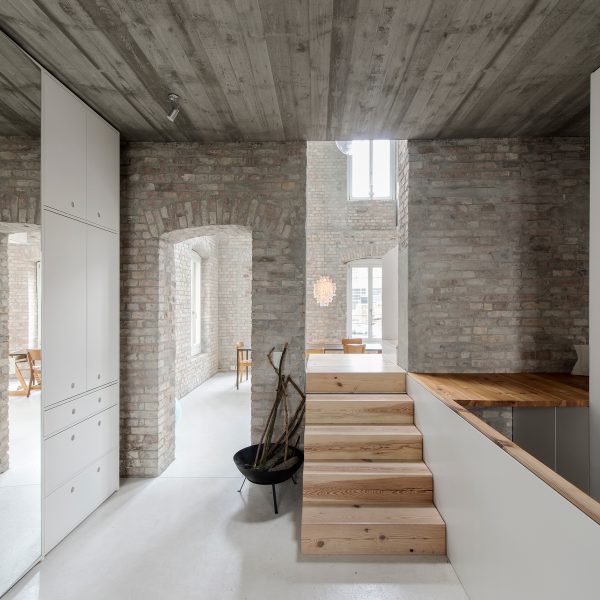 Asdfg Architekten converts former miller’s house into contemporary home