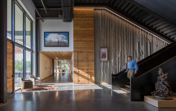 Photograph showing lobby area with textured concrete walls