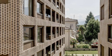 Brick "pixel patchwork" envelops Residenza Le Stelle housing by Buzzi Studio Di Architettura