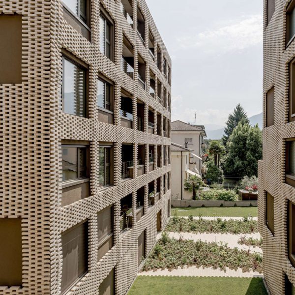 Brick "pixel patchwork" envelops Residenza Le Stelle housing by Buzzi Studio Di Architettura