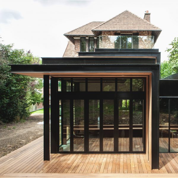 Steel and glass extension added to traditional stone house in Paris by Atelier Lame