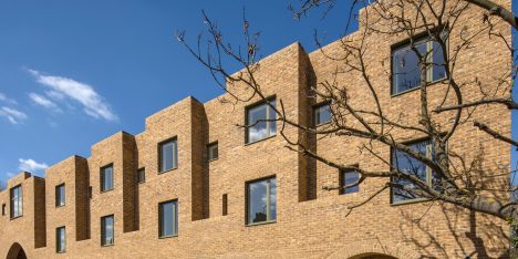 Peter Barber includes "cosy" arched entrances at east-London housing scheme