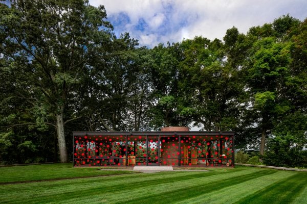 Yayoi Kusama plasters red dots across Philip Johnson's Glass House