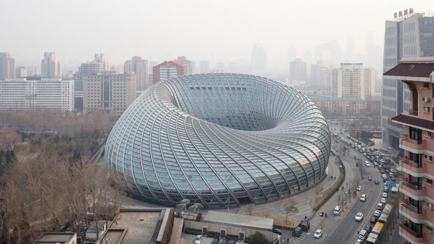 Doughnut-shaped television studio in Beijing is enclosed in a latticed shell