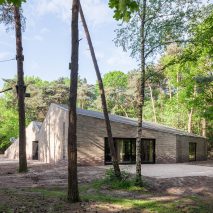 Angular brick theatre by Reset Architecture sits in a woodland clearing