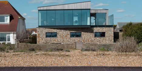 Shoreham Beach House by ABIR Architects features gabion walls filled with beach pebbles