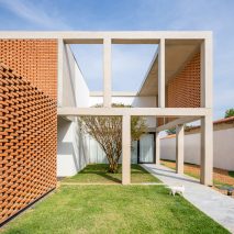 Brick screens are set into framework of concrete columns and beams at Casa Grid