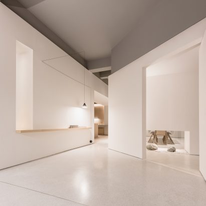 White boxes frame different areas inside Guangzhou coffee shop and co-working space