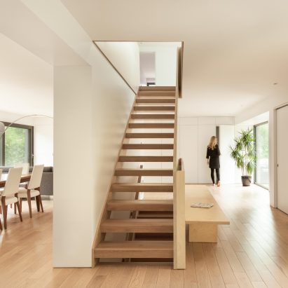 Atelier Pierre Thibault reorganises Quebec home around central plywood stairs