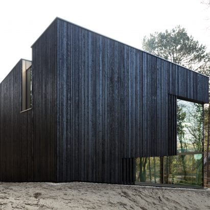 Charred timber and glass villa by VVKH Architecten is embedded in a sand dune