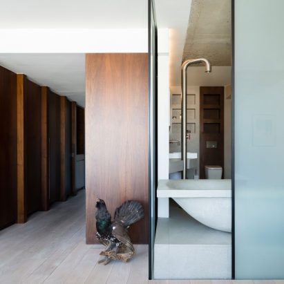 London flat by The Klassnik Corporation centres around a cast concrete bath