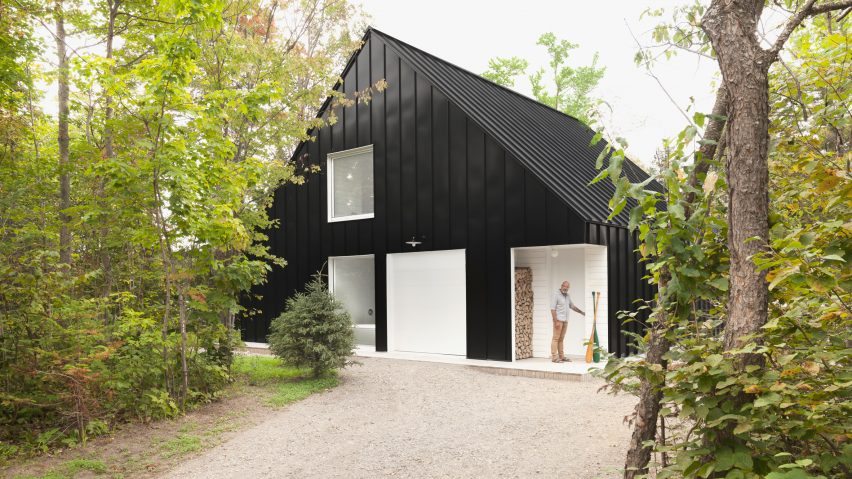 Black beachfront cabin in Canada contains expansive white interior