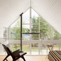 Black beachfront cabin in Canada contains expansive white interior