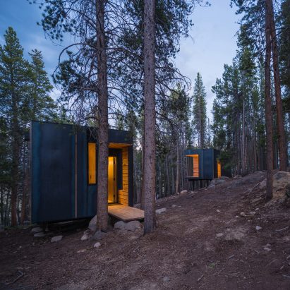 Colorado architecture students build micro cabins clad in sheets of hot-rolled steel